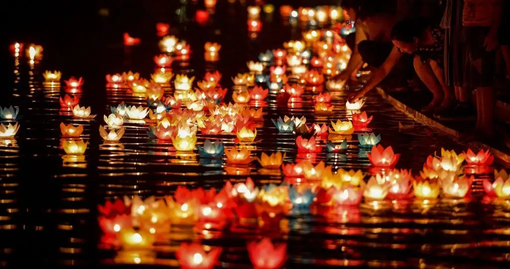 Release lanterns on the Thu Bon River