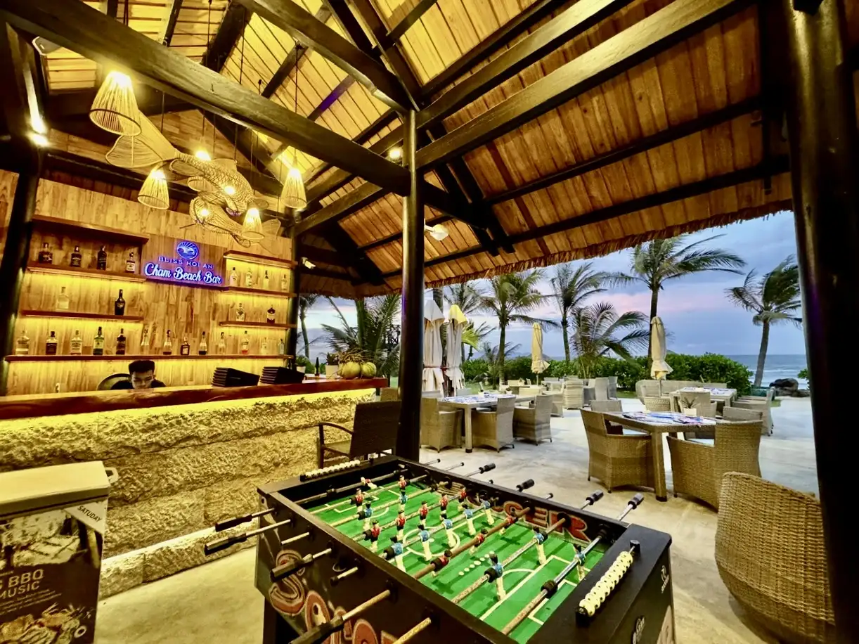 The endless blue sea, gentle waves, and golden sand come together to create a tranquil and mesmerizing view at Cham Beach Bar
