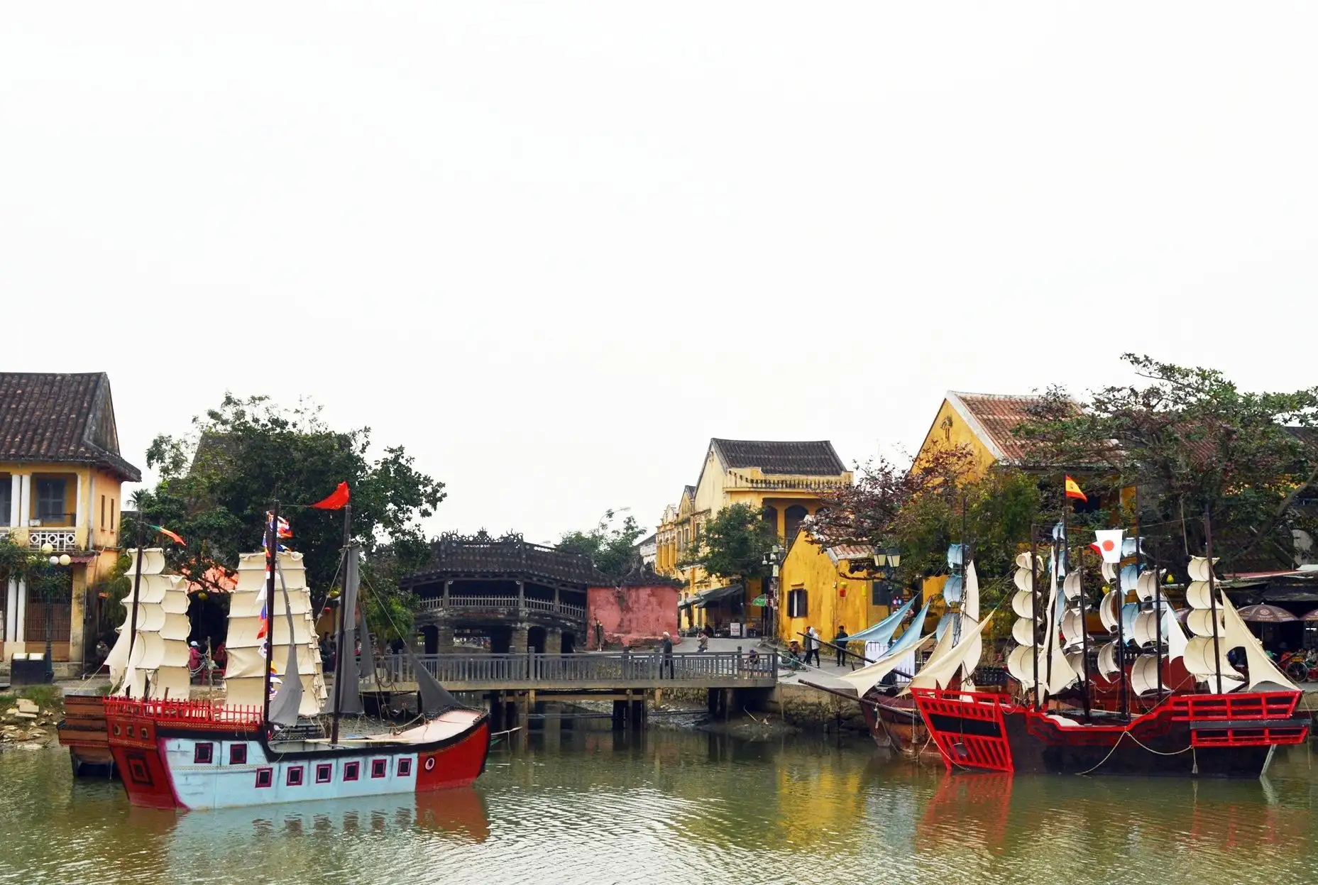 A vivid recreation of Hoi An’s bustling ancient trading port, capturing the vibrant maritime spirit of centuries past