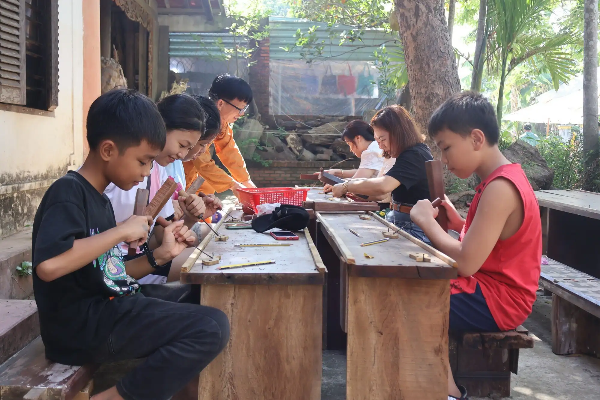 Visitors excitedly experience woodworking at Kim Bong Carpentry Village