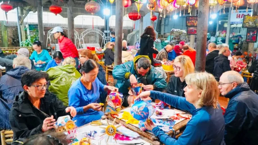 Visitors are excited and captivated by the lantern making workshop Hoi An
