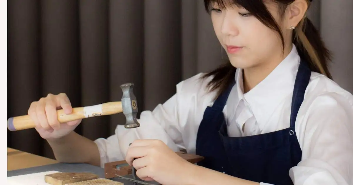 Trying out a traditional craft in the heart of Hoi An — making my very own silver ring by hand (source: Klook)