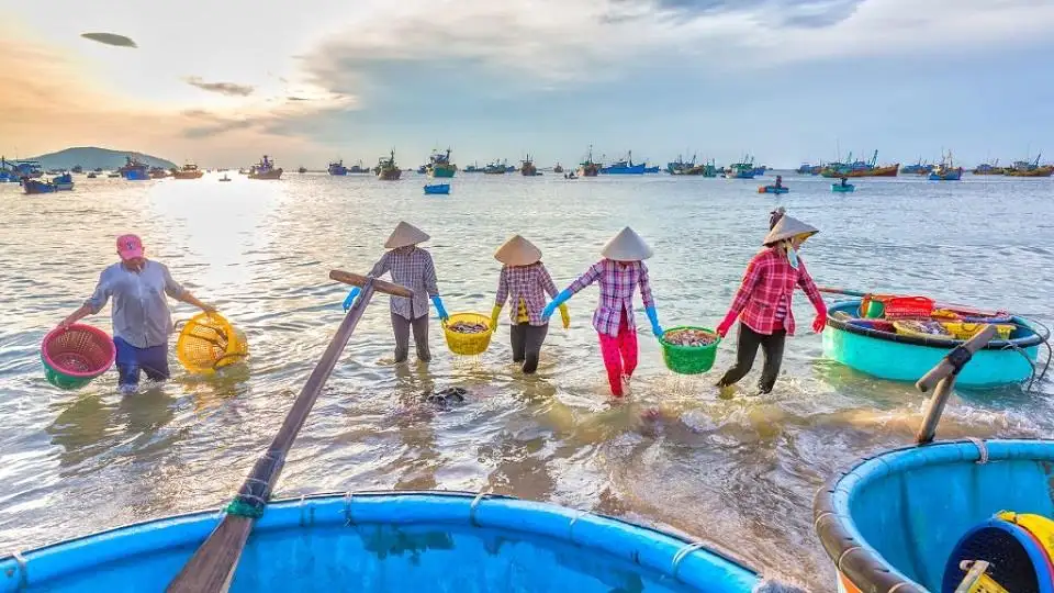 Joining the fishermen in pulling in the nets for a bountiful catch