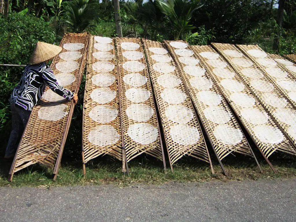 Watch the locals make traditional rice paper in Tuy Loan Village