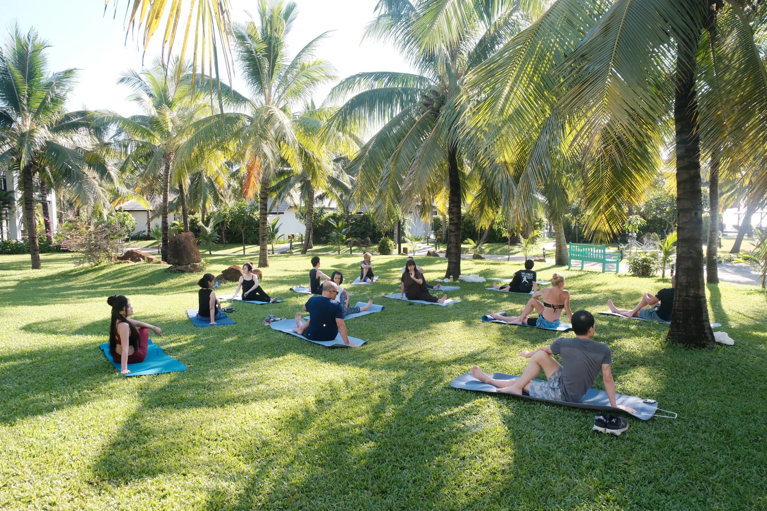 International tourists experience yoga on the beach