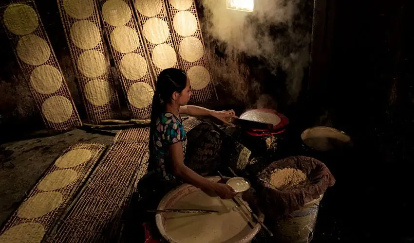 Rice paper drying on bamboo racks, Cam Kim Island craft village (Source: Explore Vietnam)