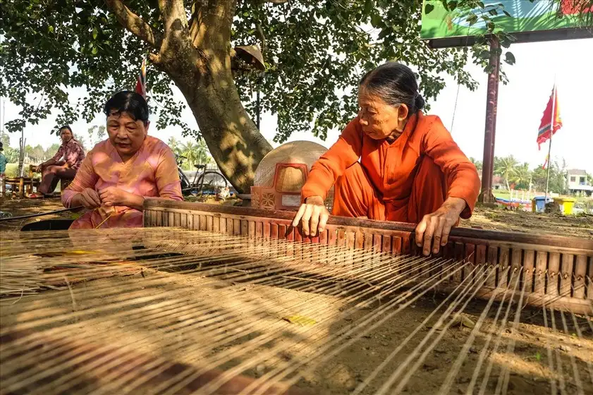 Artisan carving wood at Kim Bong Carpentry Village, Cam Kim Island 
