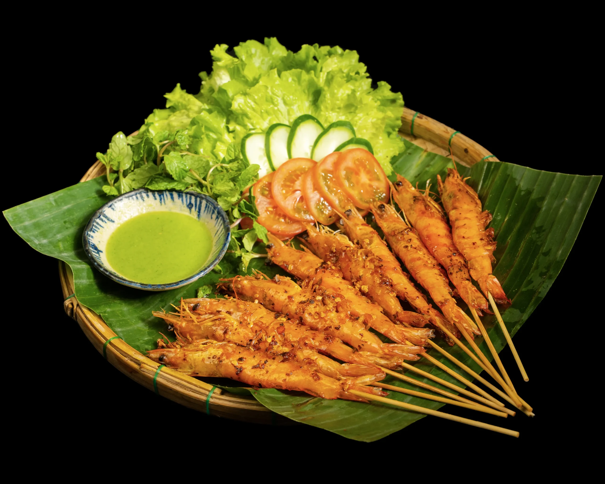 Binh Minh grilled seafood boat centerpiece being served tableside at a wedding reception