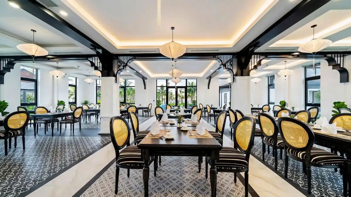 A spacious, well-lit dining area at Binh Minh Restaurant offers a comfortable setting for guests to enjoy their meals