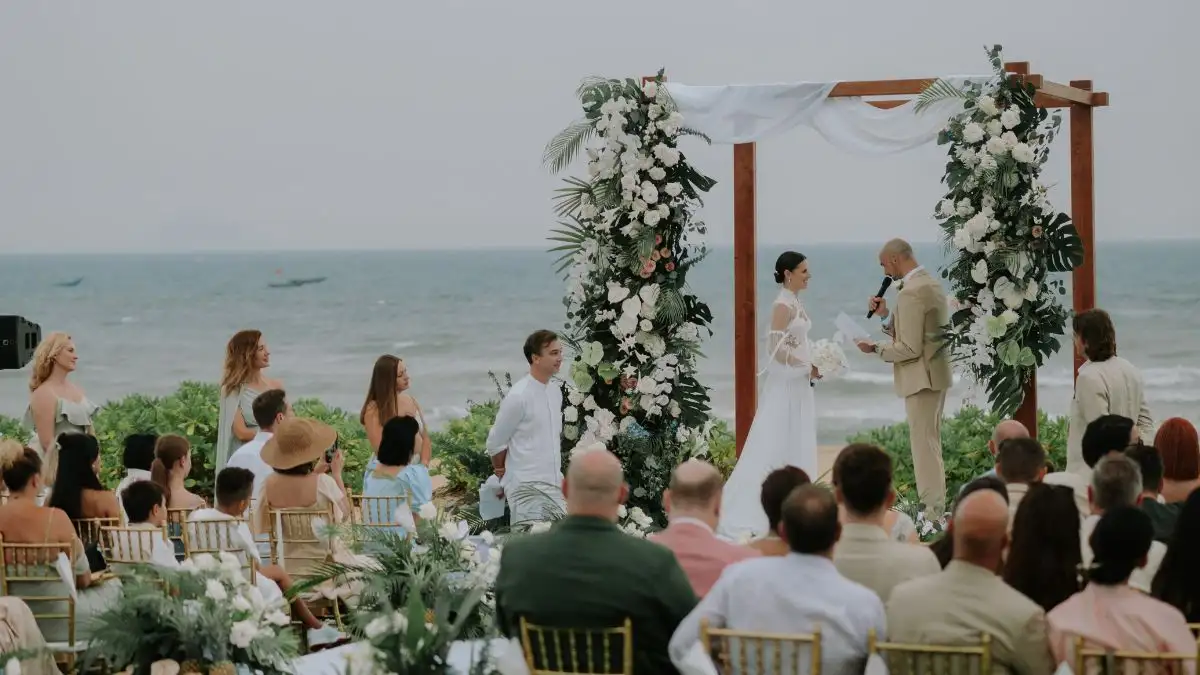 Seaside wedding ceremony highlighting a beautiful wedding venue experience - captured by Hoi An wedding photographer
