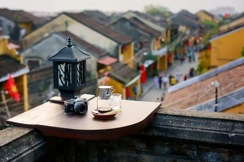 Quiet balcony coffee setup overlooking the ocean in early morning light (Source: Collected)
