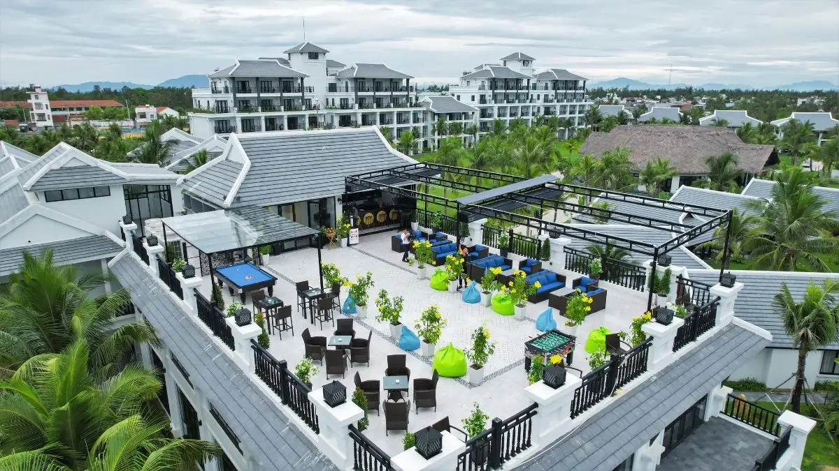 Bliss Hoi An's Rooftop Bar, a third-floor venue with 360-degree views of the ocean and resort grounds