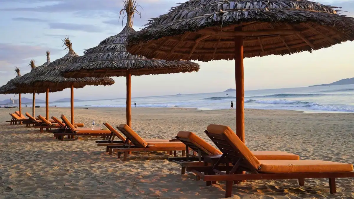 Relaxing under the coconut trees at Bliss Hoi An, with a gentle sea breeze