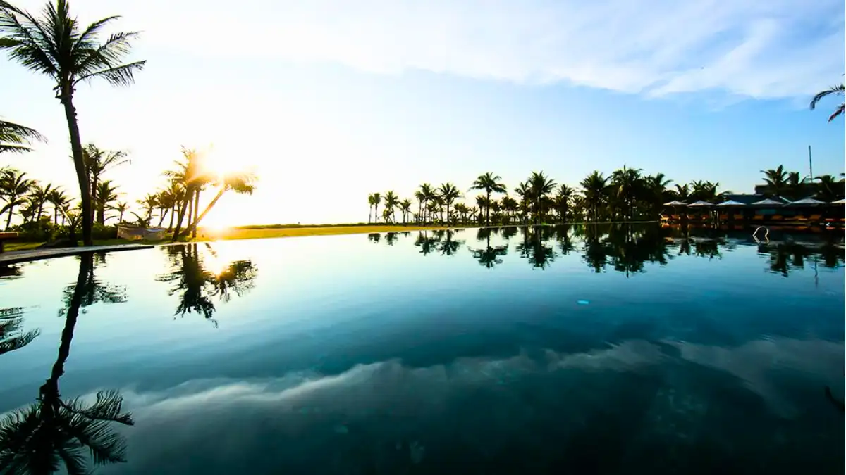 Infinity pool and beach at Bliss Hoi An Beach Resort