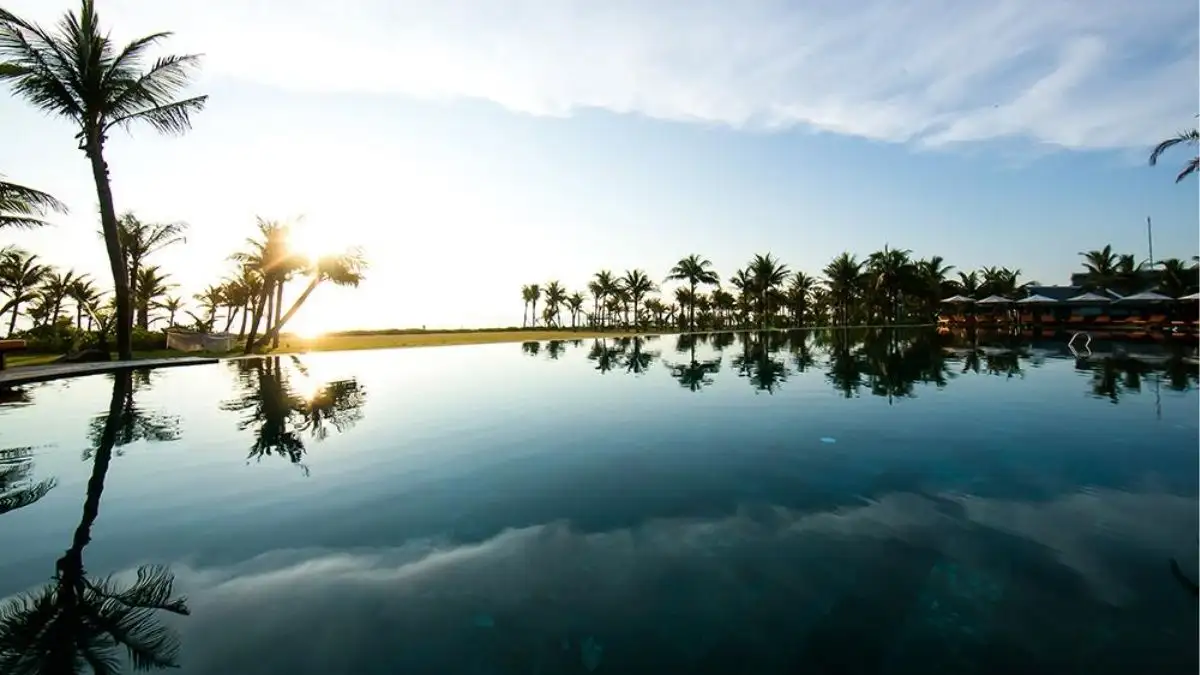The oceanfront infinity pool at Bliss Hoi An Beach Resort & Wellness on Binh Minh Beach, a quieter base for a Hoi An countryside itinerary