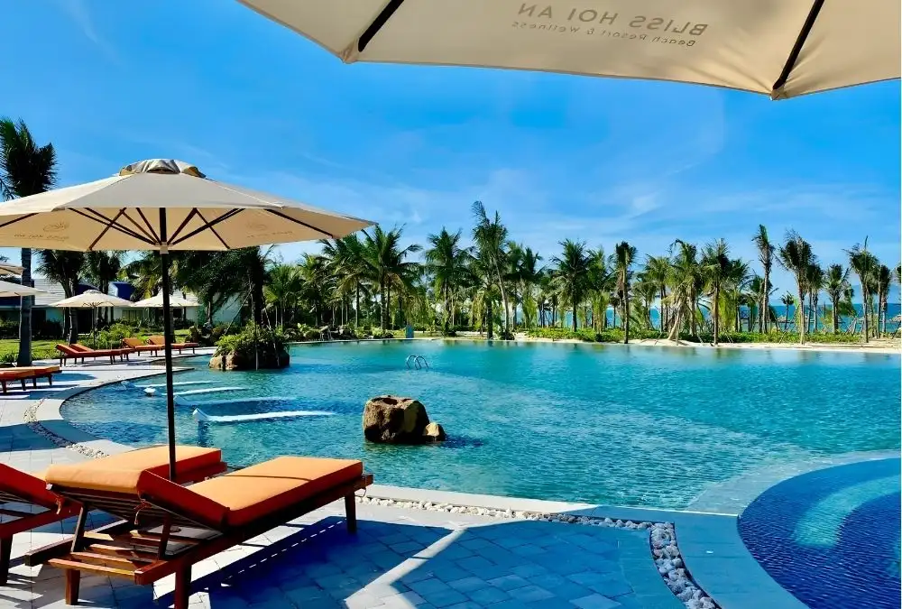 After a morning at Tra Que, return to Bliss Hoi An Beach Resort & Wellness for a relaxed afternoon by the pool