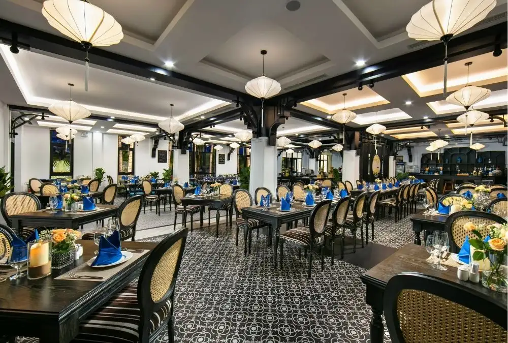 Binh Minh Restaurant at Bliss Hoi An, where the black and white interior follows an Indochine theme