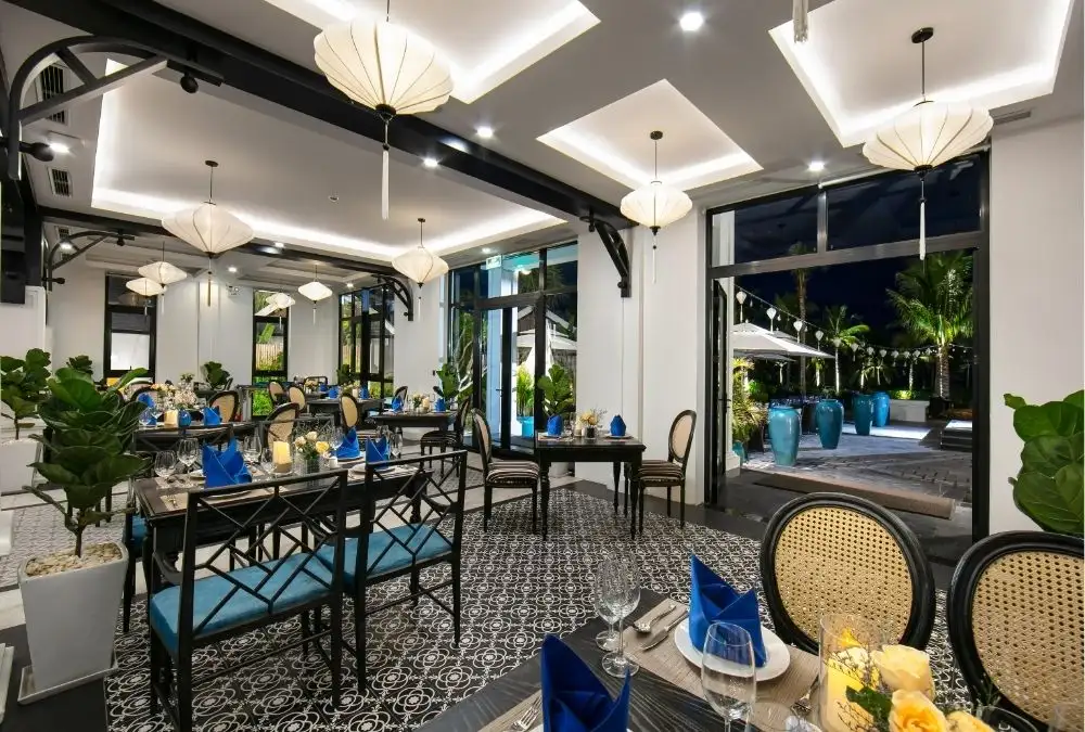 Binh Minh Restaurant at Bliss Hoi An serves Vietnamese and international dishes in an Indochine-inspired setting